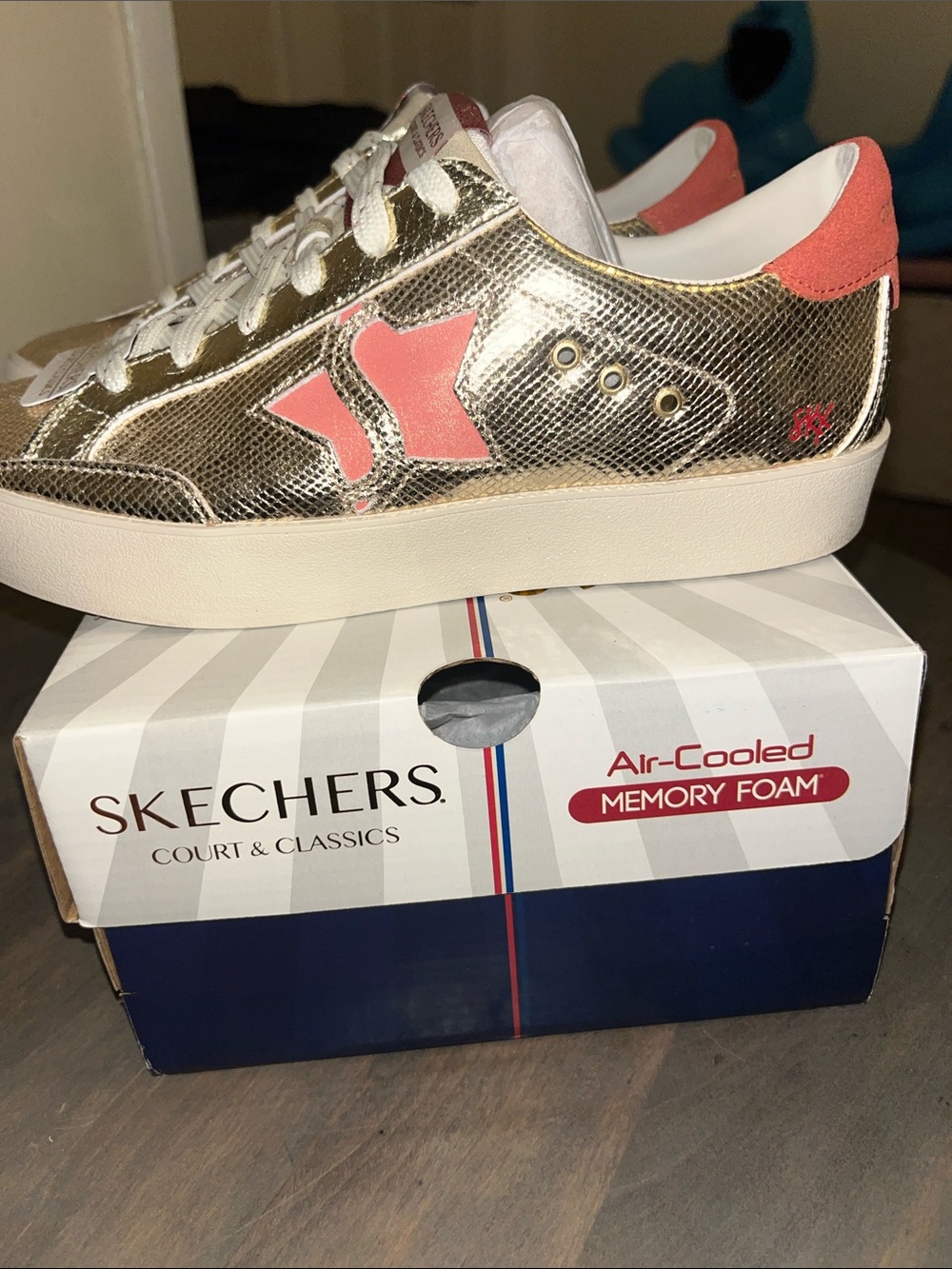 Skechers Metallic Gold Sneakers with Pink Heel Trim